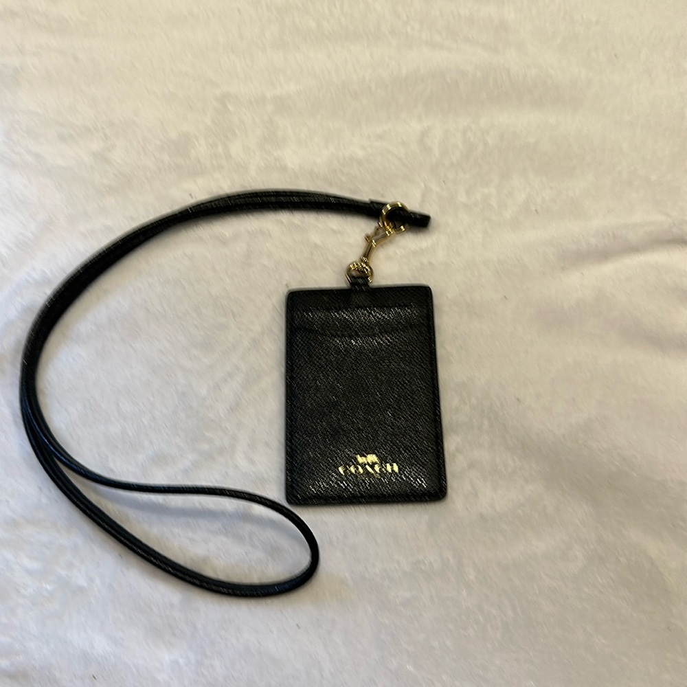 New Coach lanyard black with gold.